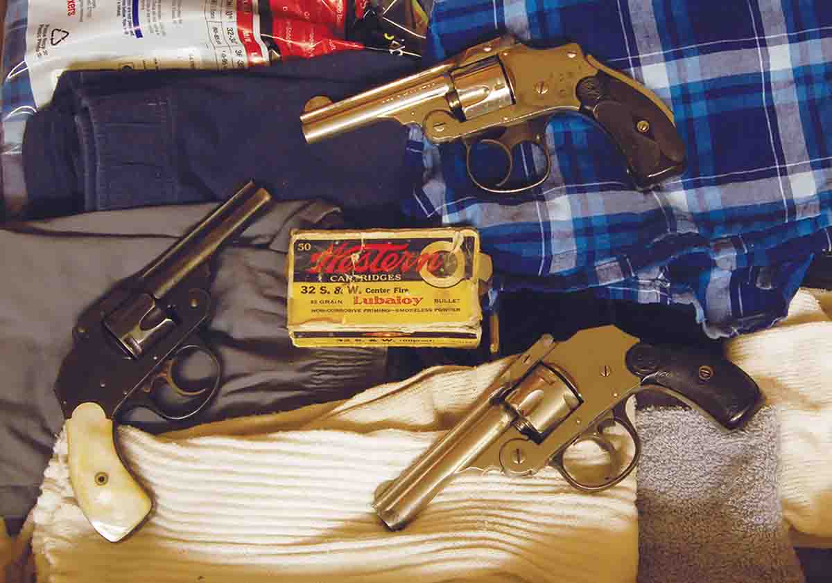 Often called “dresser drawer” or “sock drawer” guns in the early 1900s, these .32 Smith & Wesson (S&W) revolvers are (clockwise from left): a blued Iver Johnson with pearl grips, a S&W Safety Hammerless and a nickel-plated Iver Johnson.